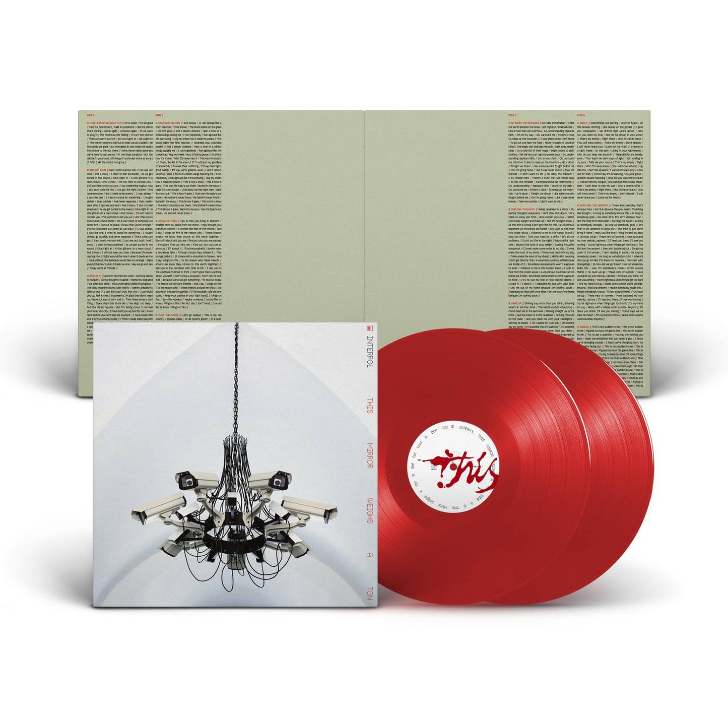Interpol - This Mirror Weighs a Ton (Transparent Red) Vinyl Red vinyl record with a cover featuring a chandelier illustration on a white background