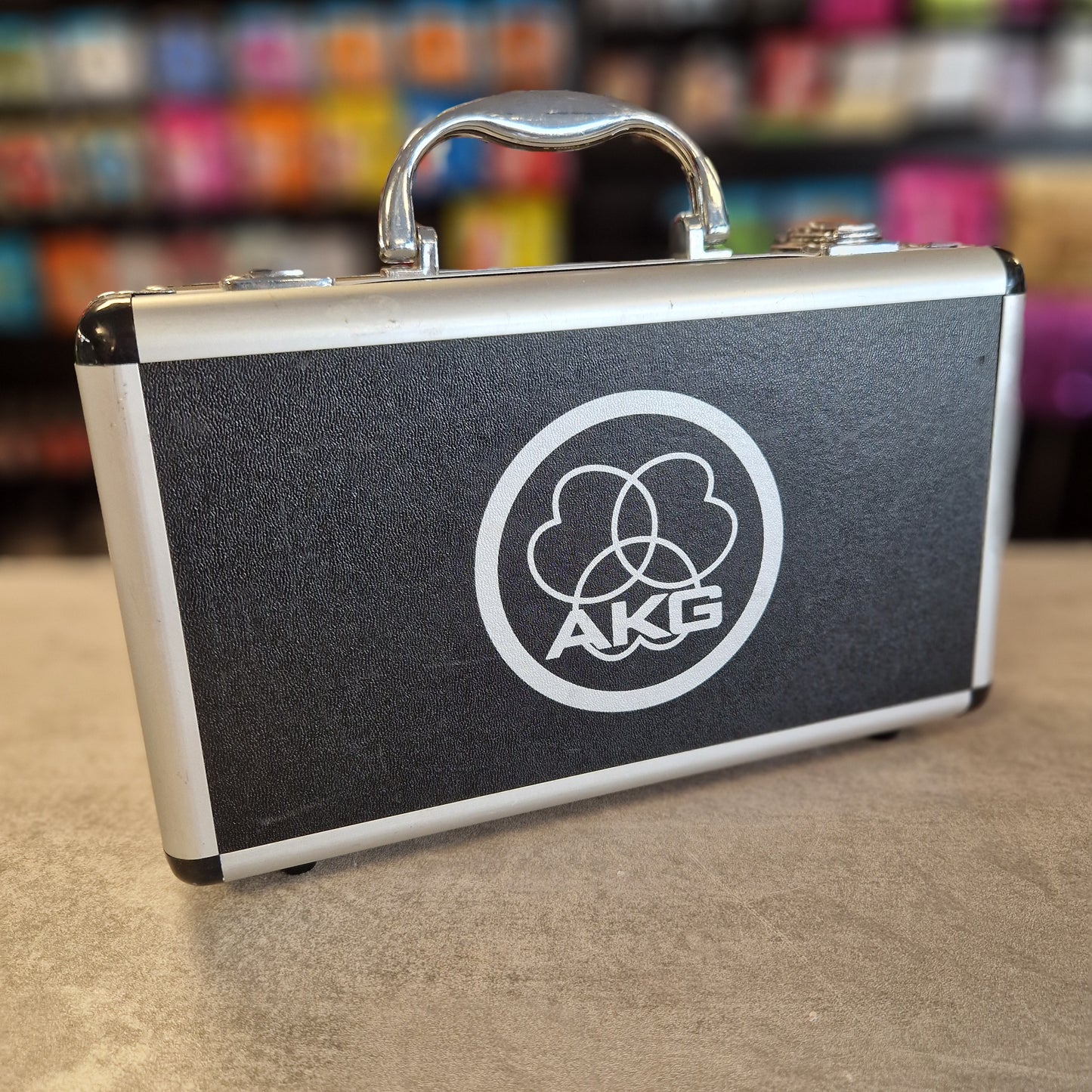 AKG C1000S Black case with a logo on a textured surface
