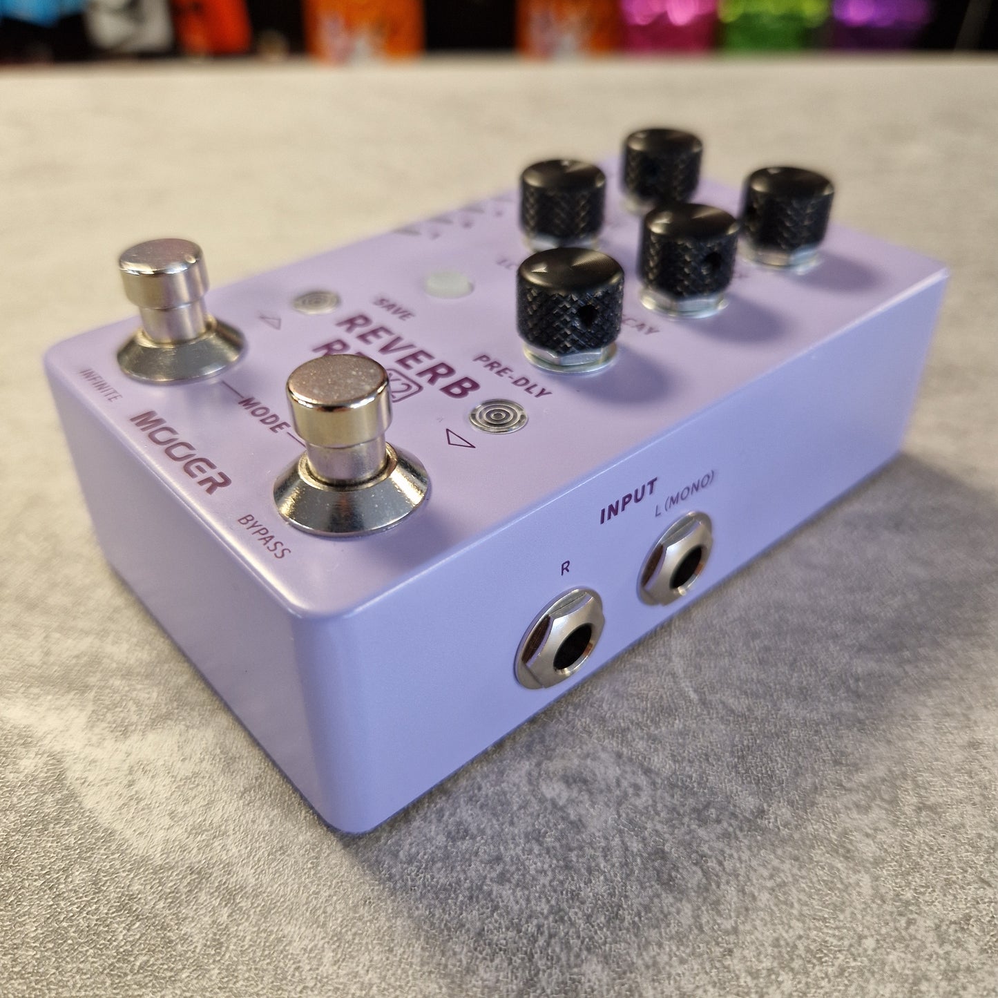 Mooer R7 X2 Reverb guitar effects pedal on a textured surface