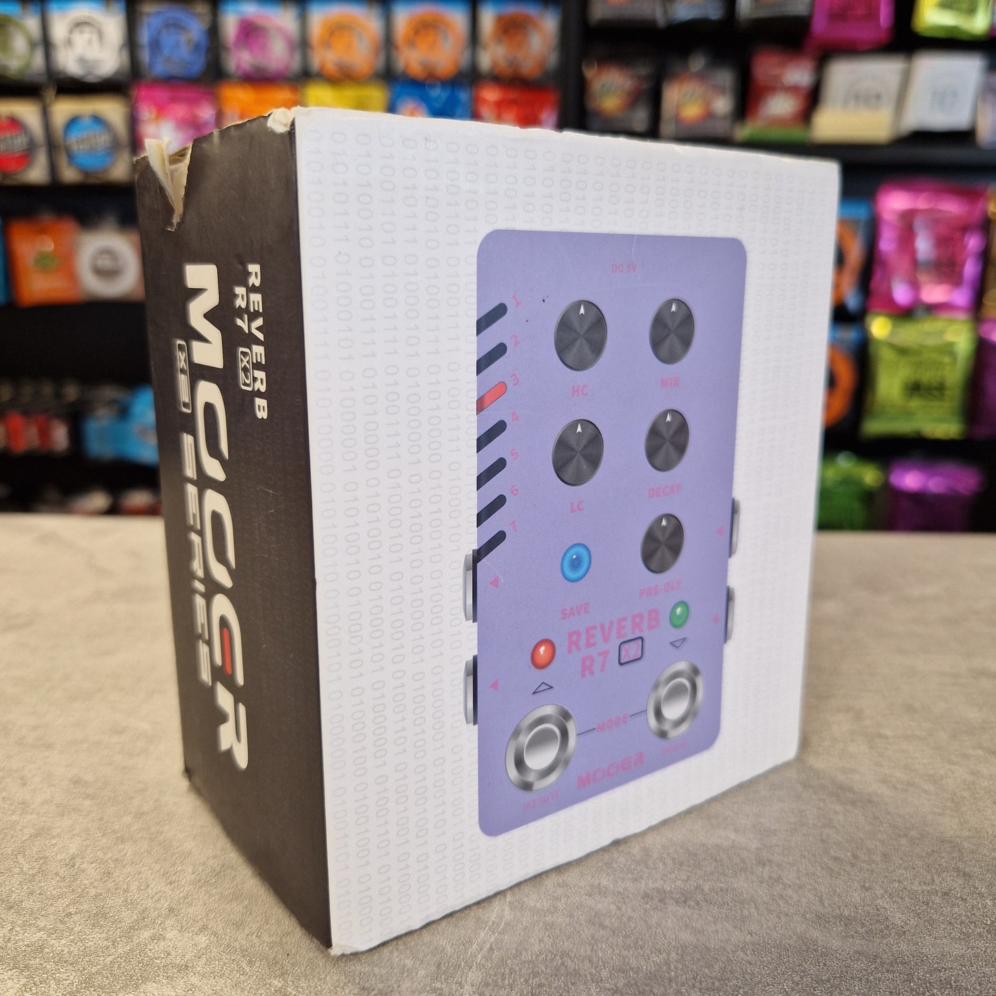 Mooer R7 X2 Music effect pedal with 'MOOER' branding on a white box against a colourful background.