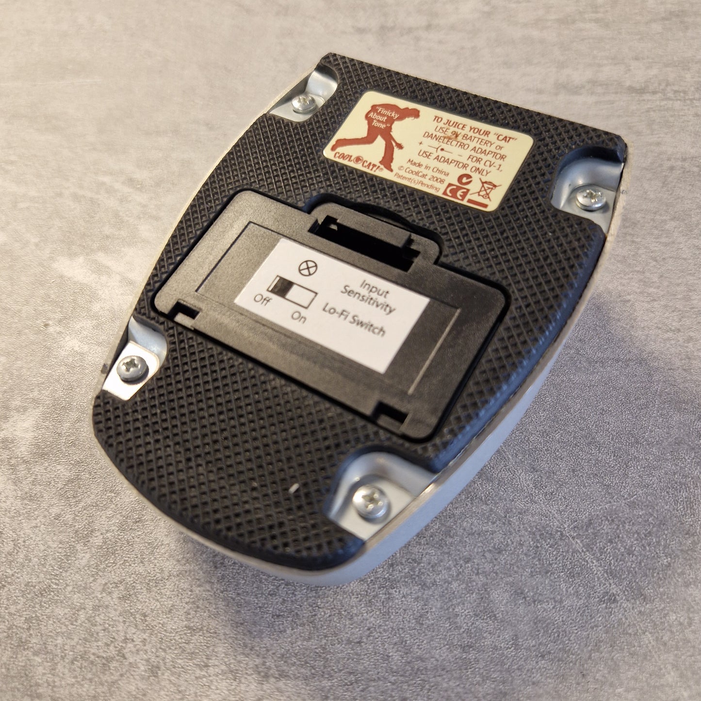 Danelectro Cool Cat V2 Drive Black electronic switch or module with labels on a gray background