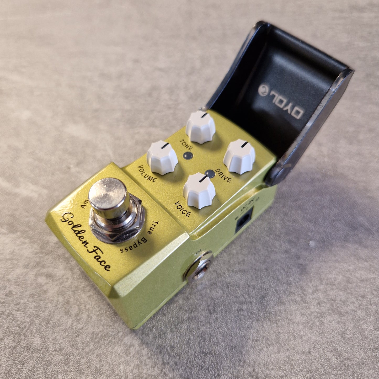 Joyo JF-308 Guitar effects pedal with 'Golden Face' branding on a textured surface