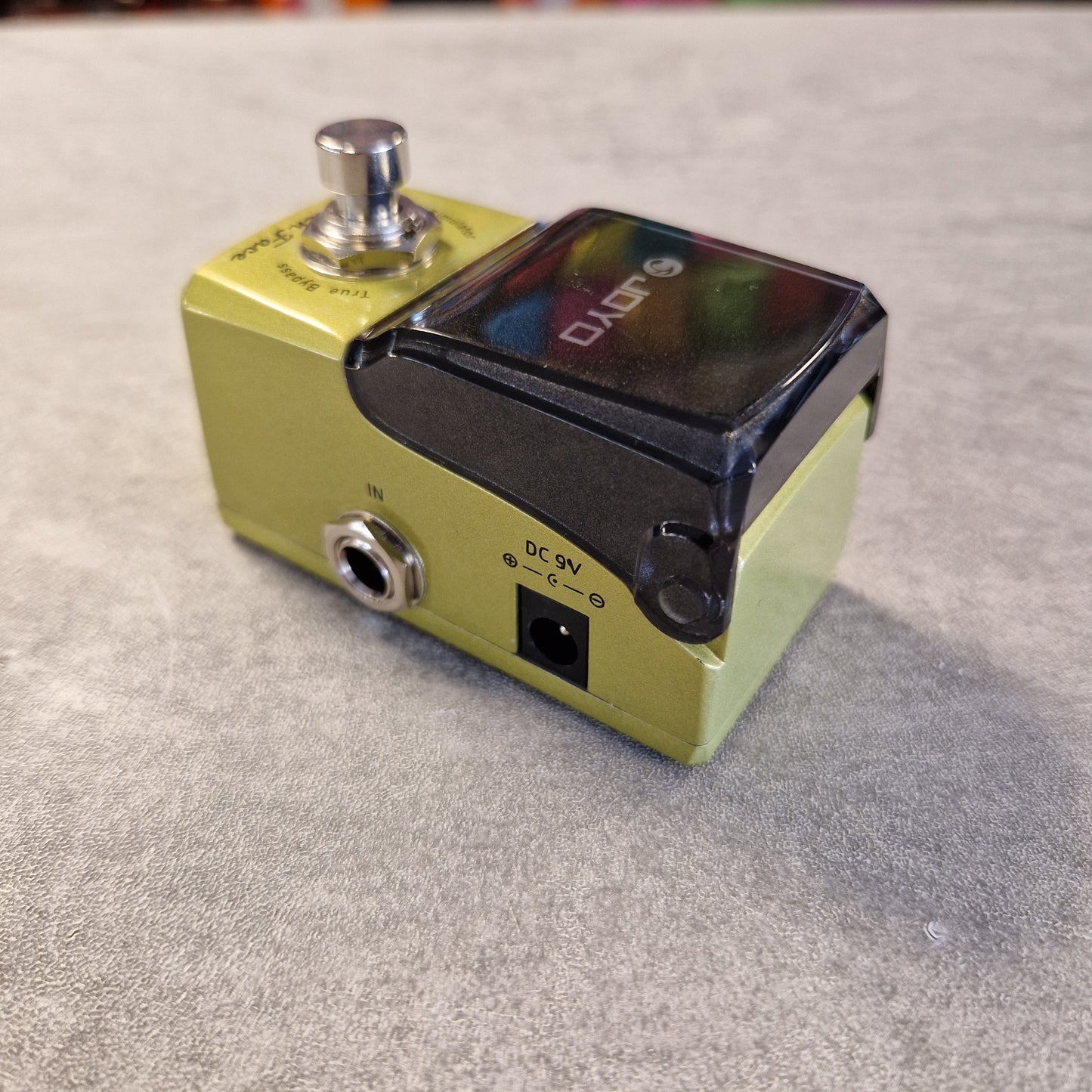 Joyo JF-308 Yellow guitar effects pedal with JOYO branding on a gray surface
