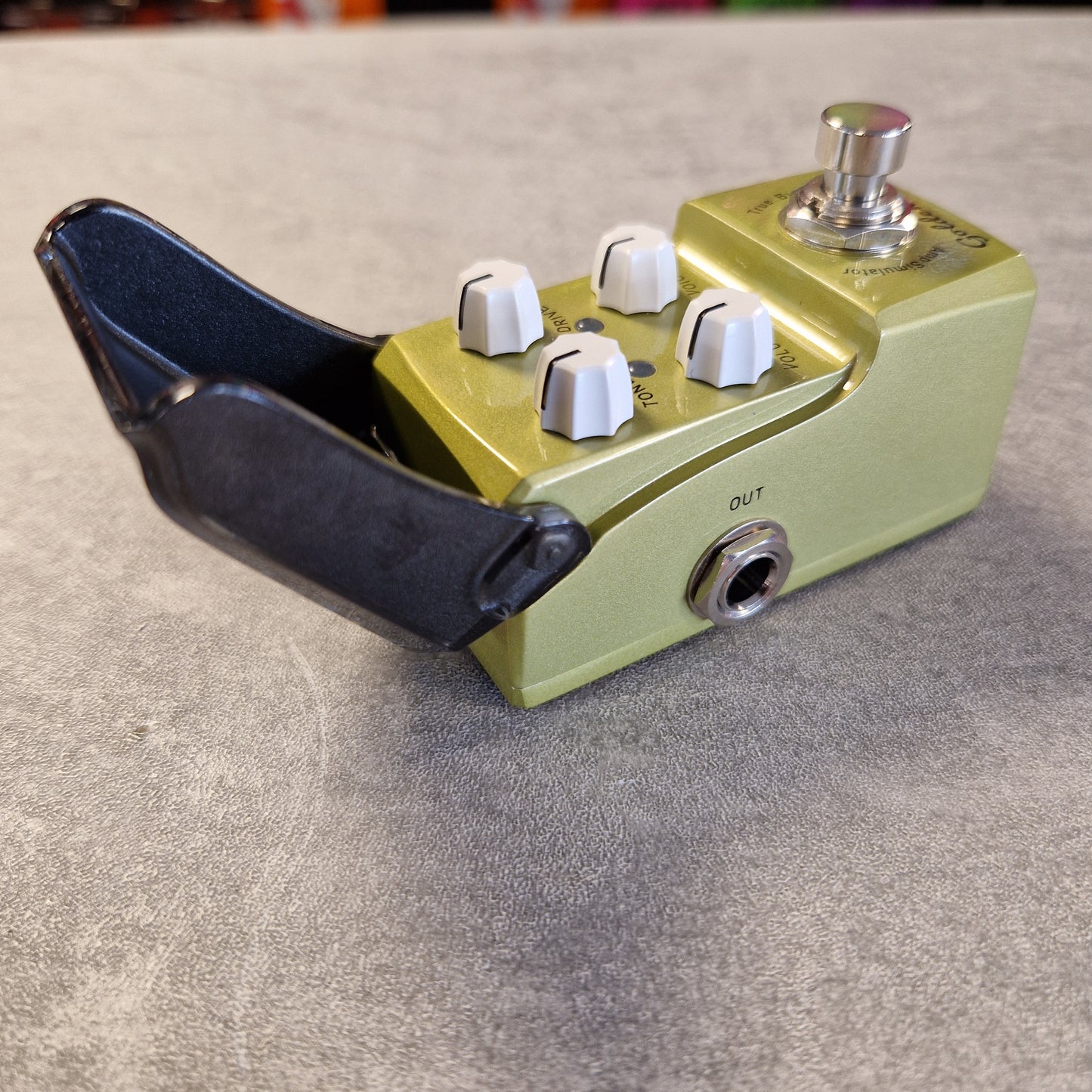 Joyo JF-308 Guitar effects pedal with green casing and white knobs on a textured surface
