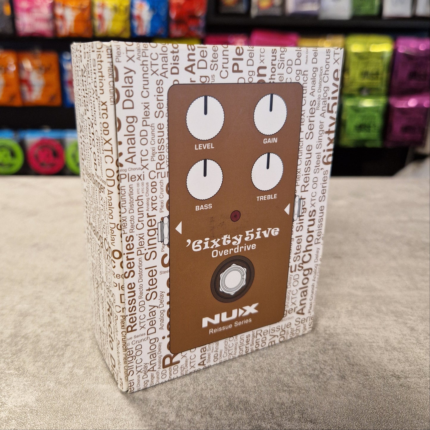 Pre-Owned NUX with control knobs on a textured surface