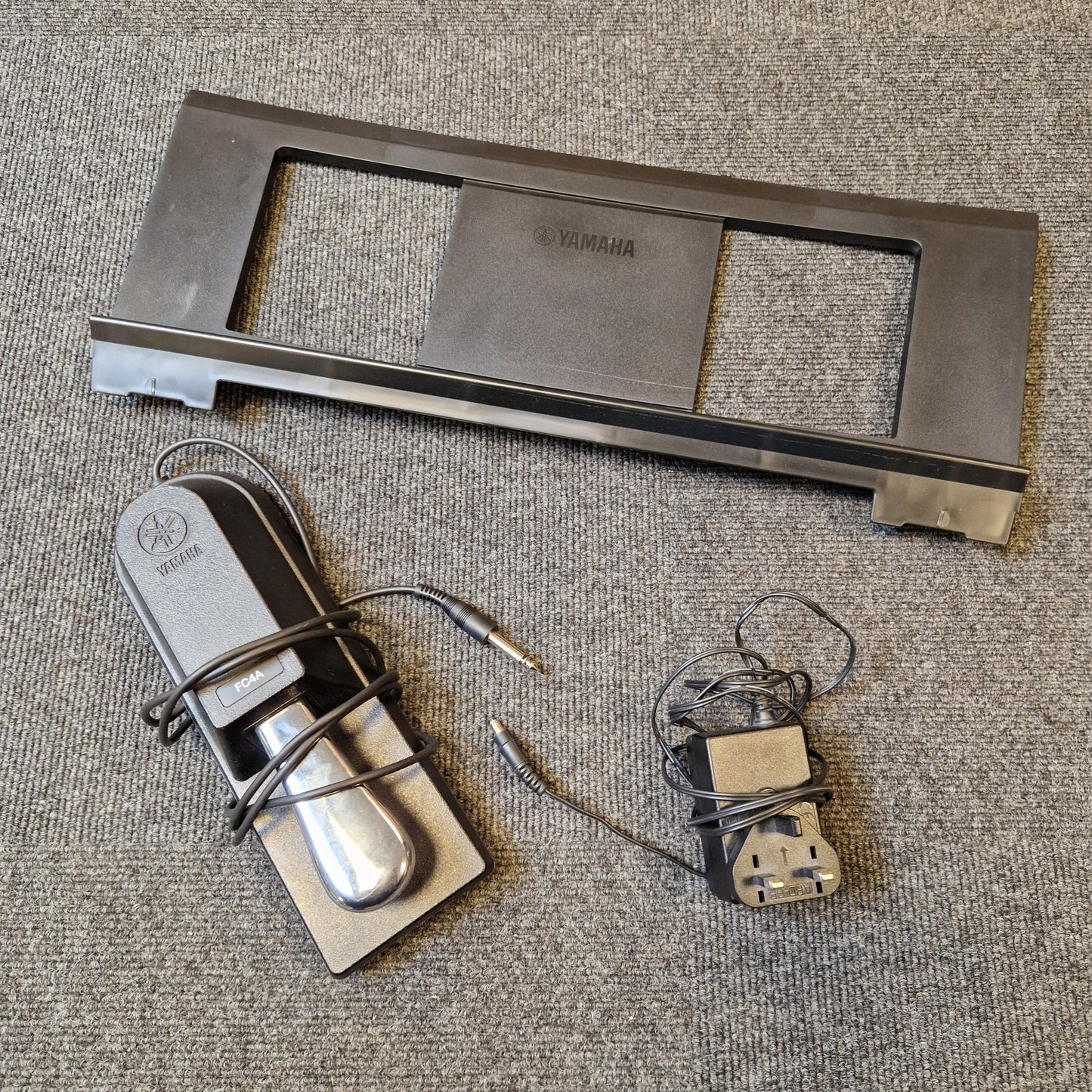 Pre-Owned Yamaha PSR-EW310 Metal door handle assembly on a textured surface