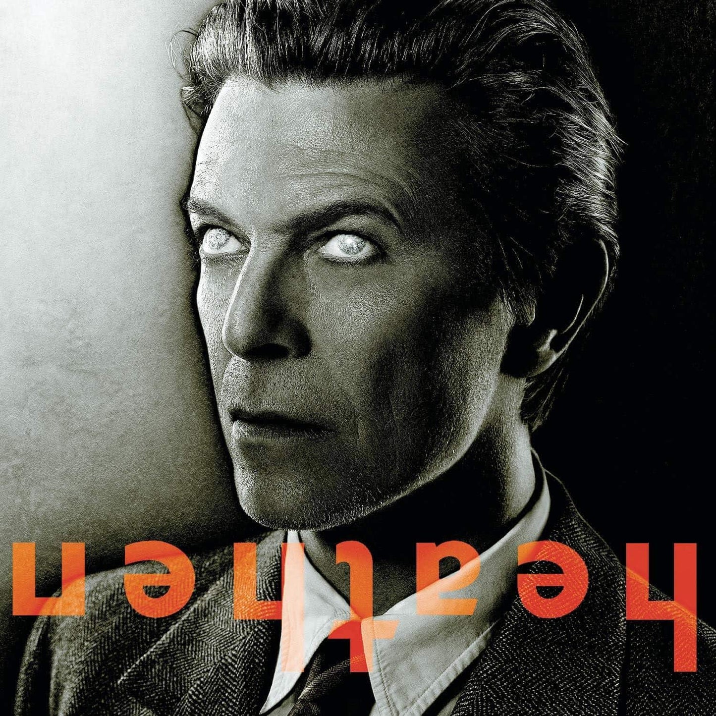 David Bowie - Heathen Vinyl Black and white portrait of a person with a stylized album cover text overlay.
