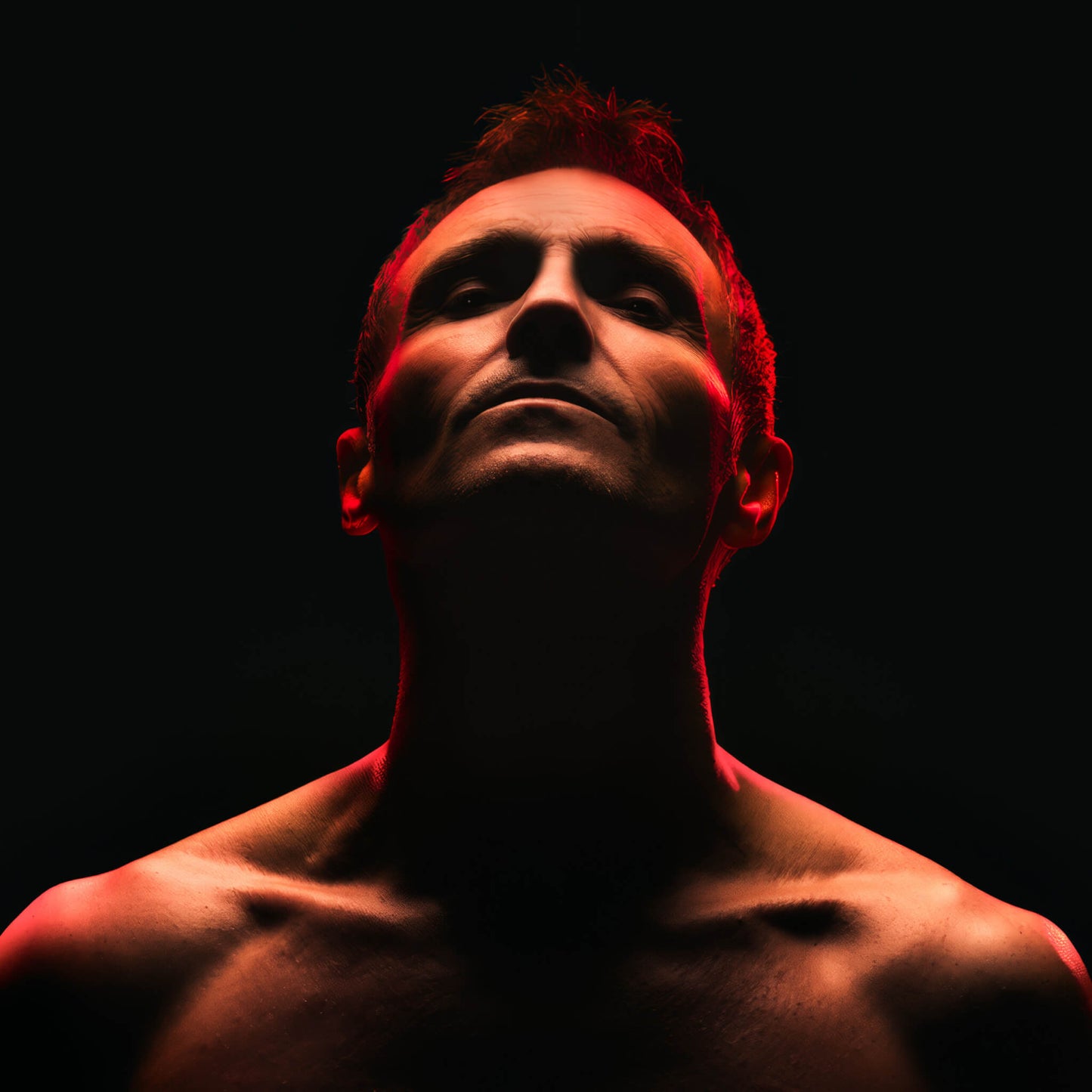 Marti Pellow - The Game Man with a dark background and red lighting