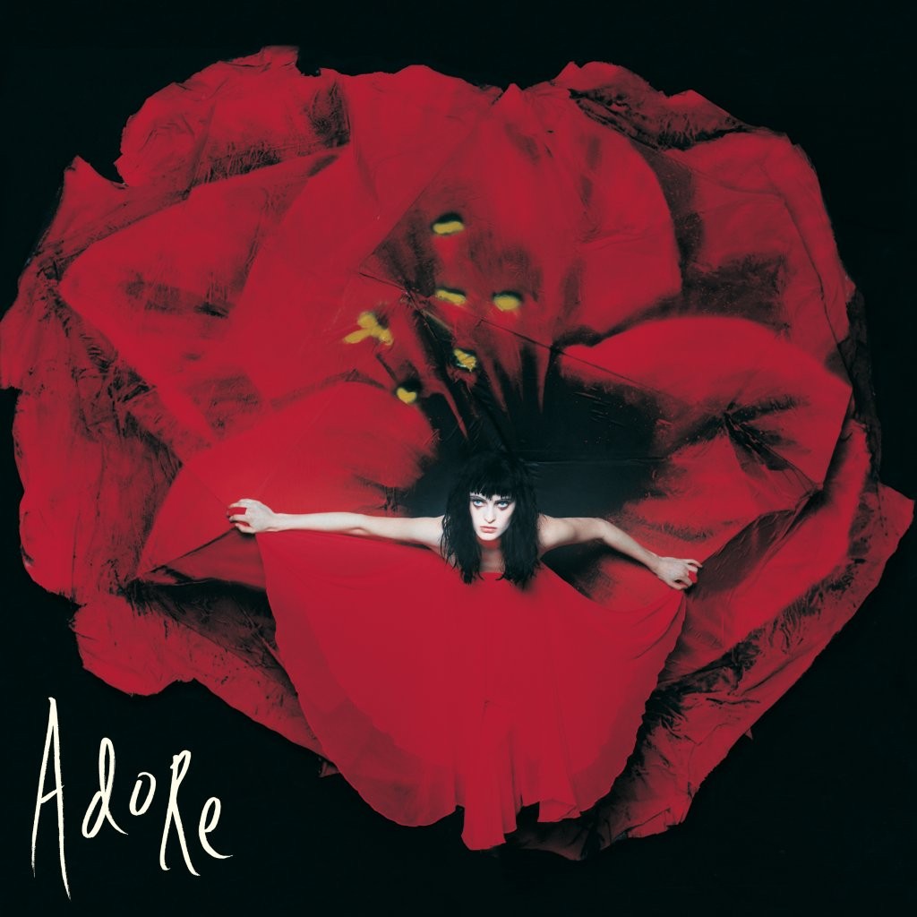 Smashing Pumpkins - Adore Vinyl Album cover art for 'Adore' featuring a woman in a red dress spread out like a flower against a black background, with the title 'Adore' in white script in the lower left corner.