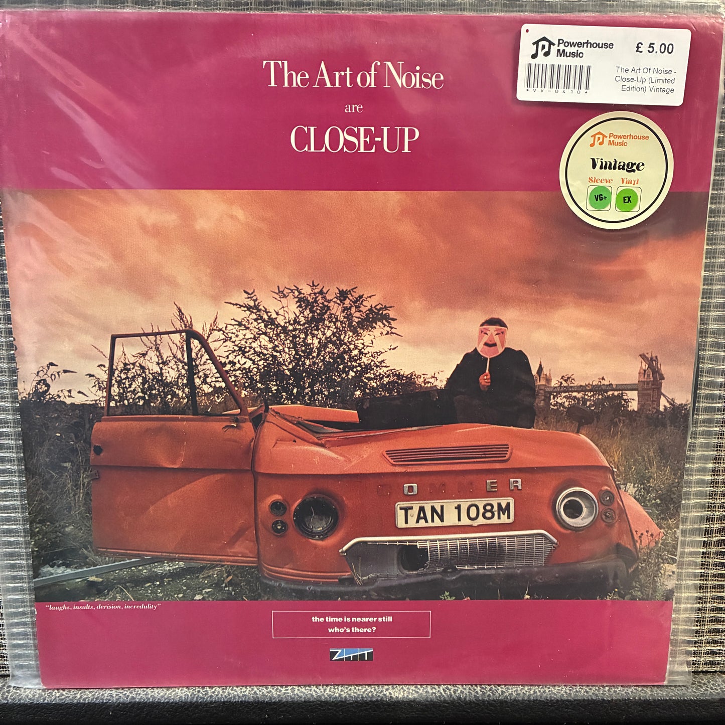 The Art Of Noise - Close-Up Vinyl record cover for 'Close Up' by The Art of Noise with a man in a car and pink background.
