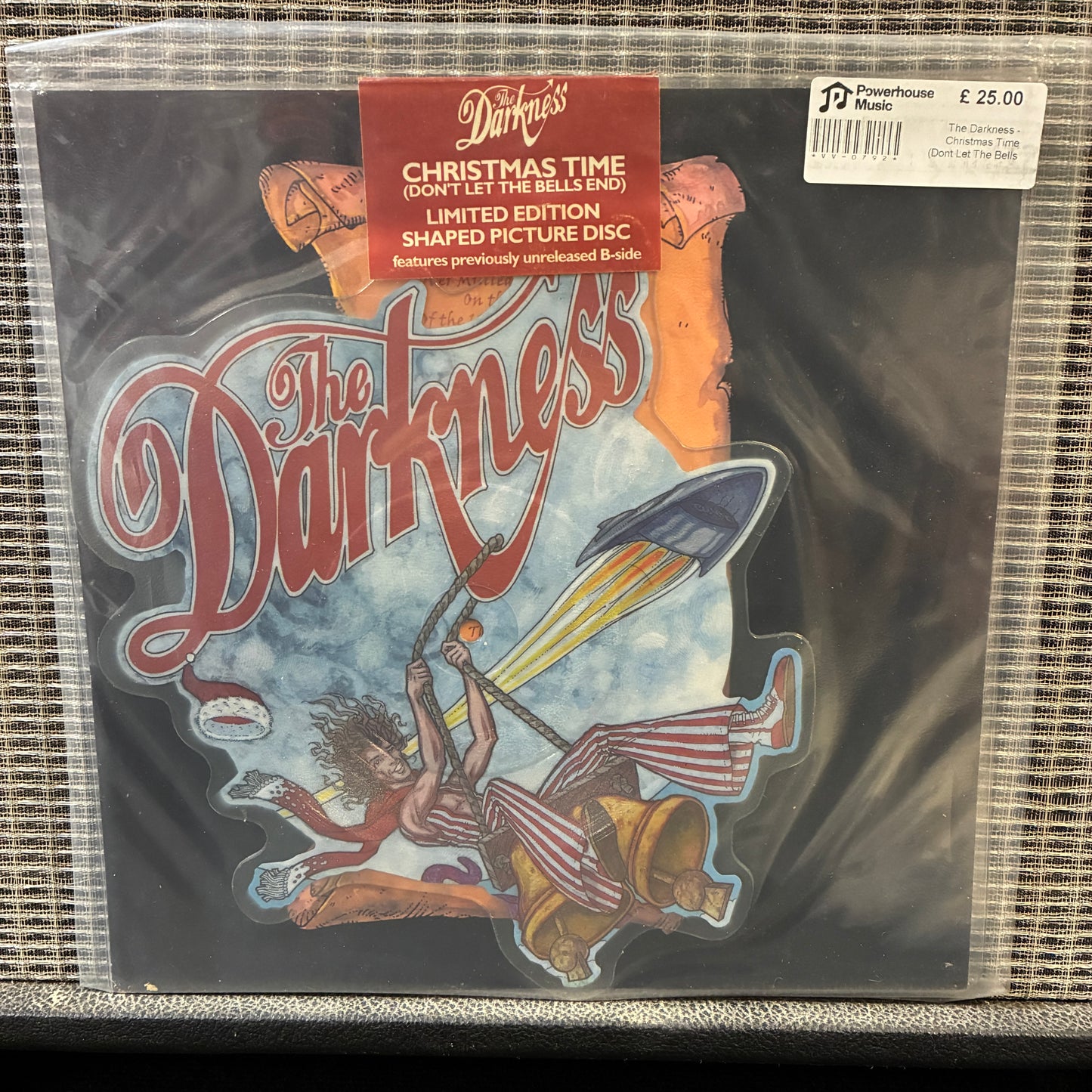 The Darkness - Christmas Time Vinyl record with 'The Darkness' album cover featuring a rocket and colorful design.