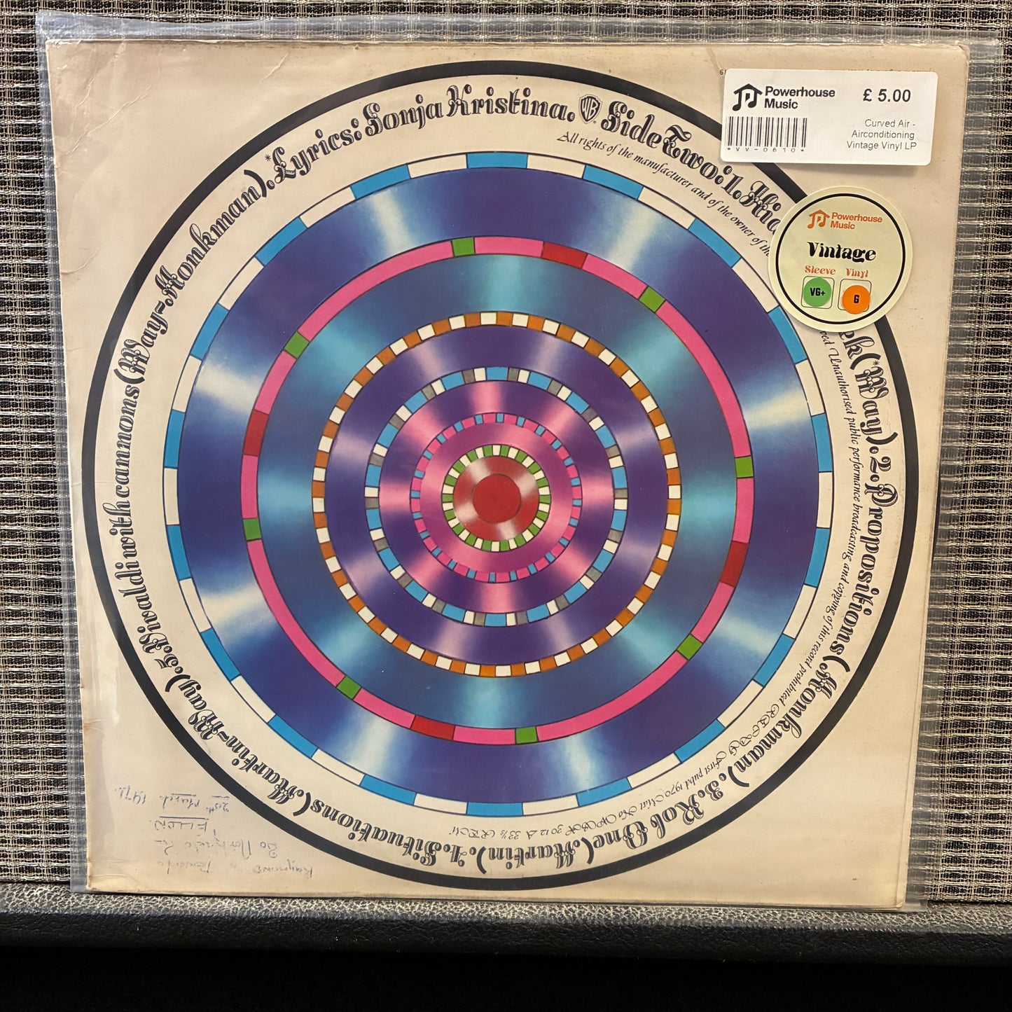 Curved Air - Airconditioning Vinyl record with a colorful spiral design on a beige background