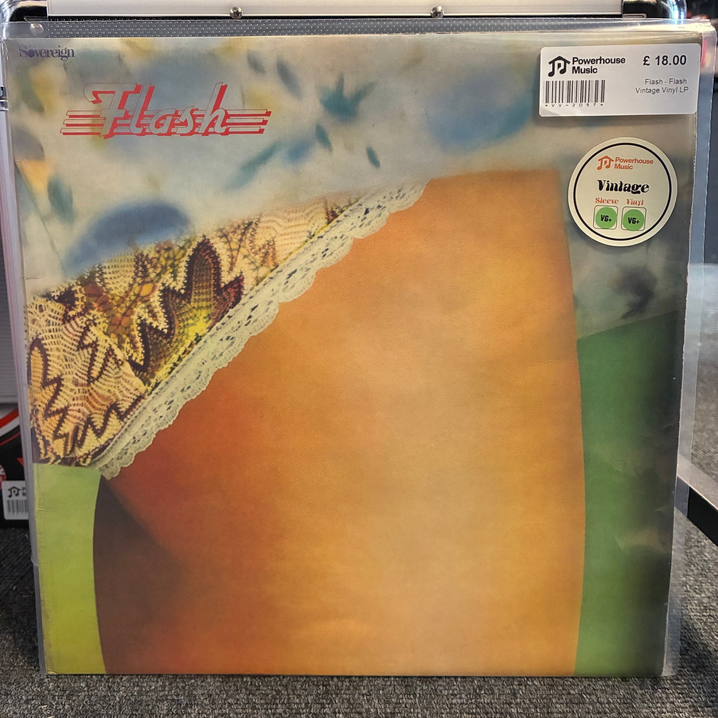 Flash - Flash Vintage Vinyl LP A vinyl record sleeve for the band Flash, featuring a close-up photograph of a person's bare torso with lace underwear. The sleeve has a clear plastic shrink-wrap, a white barcode sticker in the top right, and a circular 'Vintage' label on the right side.