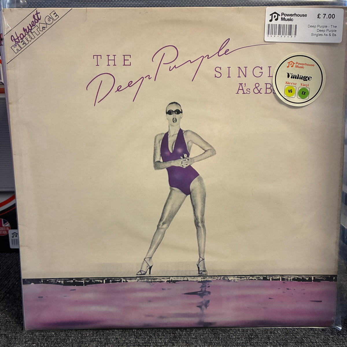 Deep Purple - The Deep Purple Singles A's & B's Vintage Vinyl LP The Deep Purple 'Single As & B' vinyl record album cover, showing a vintage-style illustration of a woman in a purple swimsuit on a cream background with a purple reflective waterline at the bottom. A JD Powerhouse Music sticker is visible in the top right corner.