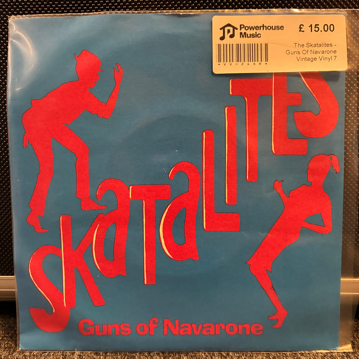 The Skatalites - Guns Of Navarone Vintage Vinyl 7" Single The Skatalites - Guns of Navarone vintage vinyl record sleeve, sealed in plastic with a Powerhouse Music sticker on the top right, set against a dark textured background.