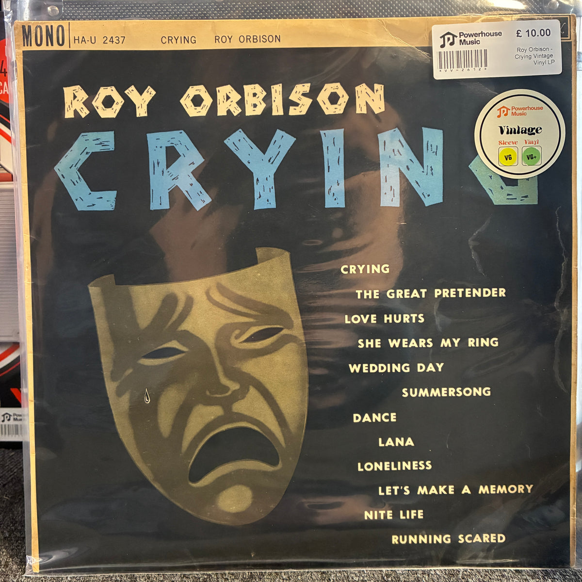 Roy Orbison - Crying Vintage Vinyl LP Roy Orbison 'Crying' vinyl record album cover, showing a large gold-toned crying mask on a dark background with tracklist text and a Powerhouse logo.