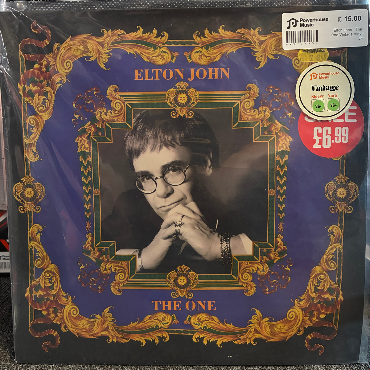 Elton John - The One Vintage Vinyl LP Elton John 'The One' vinyl record album cover, sealed in plastic shrink wrap. The cover features a dark blue background with an ornate gold baroque frame and a black-and-white portrait of Elton John wearing glasses.