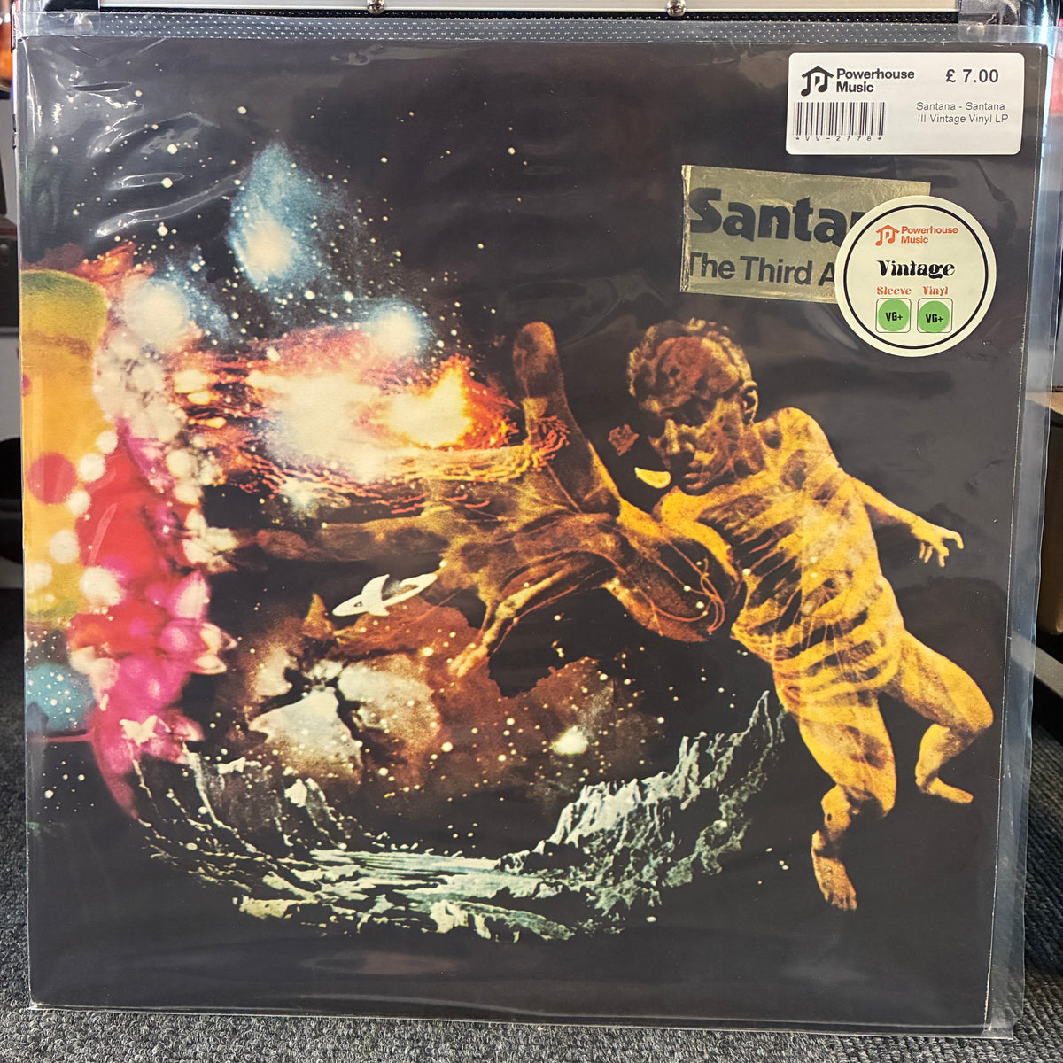 Santana - Santana III Vintage Vinyl LP A vinyl record sleeve for Santana's 'The Third Album' in its shrink wrap, featuring a cosmic illustration of a golden figure against a starry black background. Powerhouse Music and Vintage stickers are visible on the sleeve.