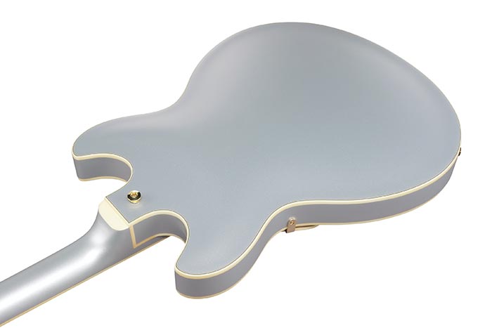 Ibanez AS73G-MSF Close-up of a gray electric guitar body with gold trim on a white background