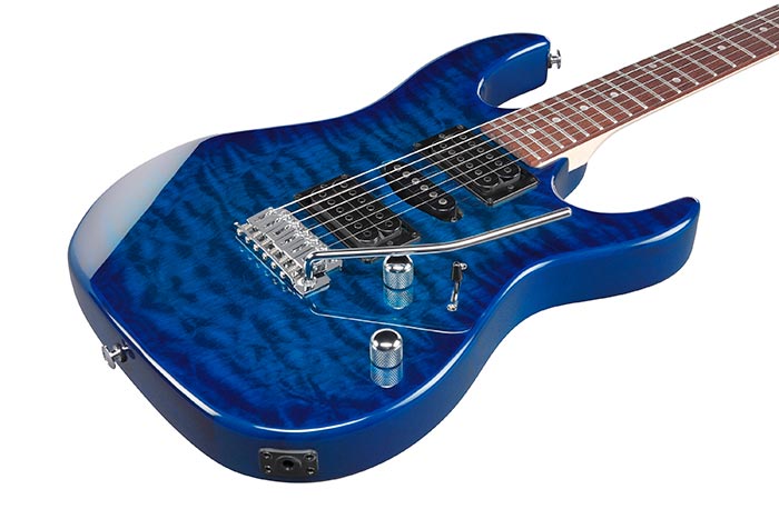 Blue electric guitar on a white background