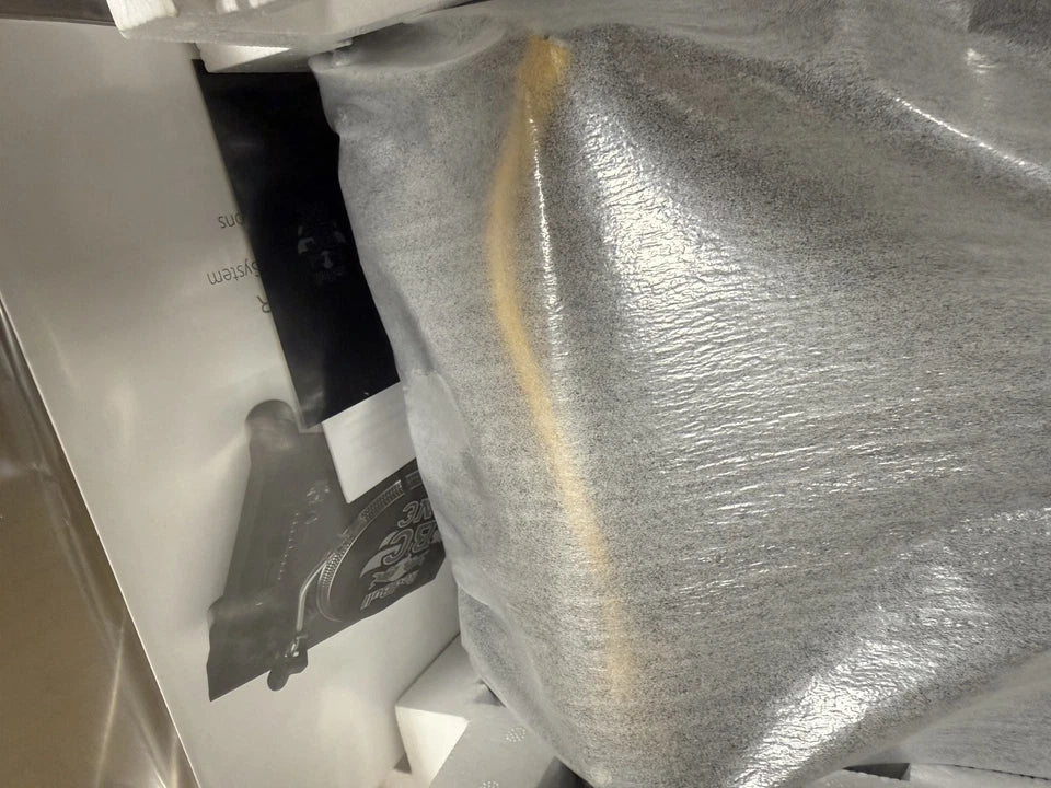 Pre-Owned Technics Close-up of a textured surface with a brand logo in the background