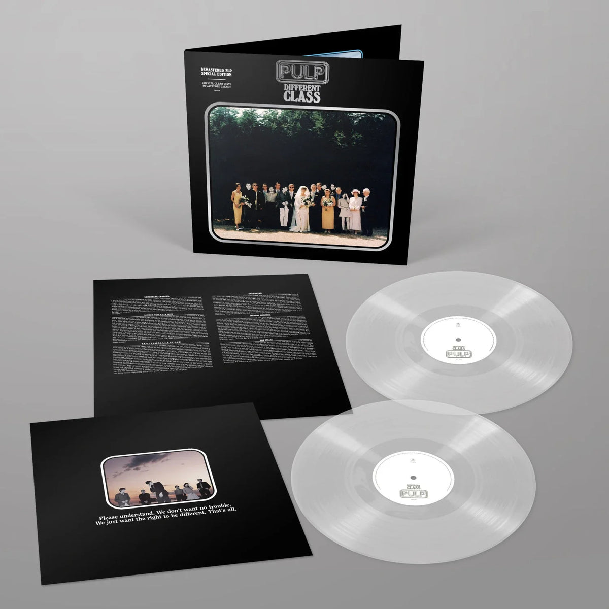 Pulp - Different Class (Clear) Vinyl NAD26 Fulp - Never Been Classified vinyl record LP with black gatefold cover, inner sleeves, and two transparent clear vinyl records on a gray background.