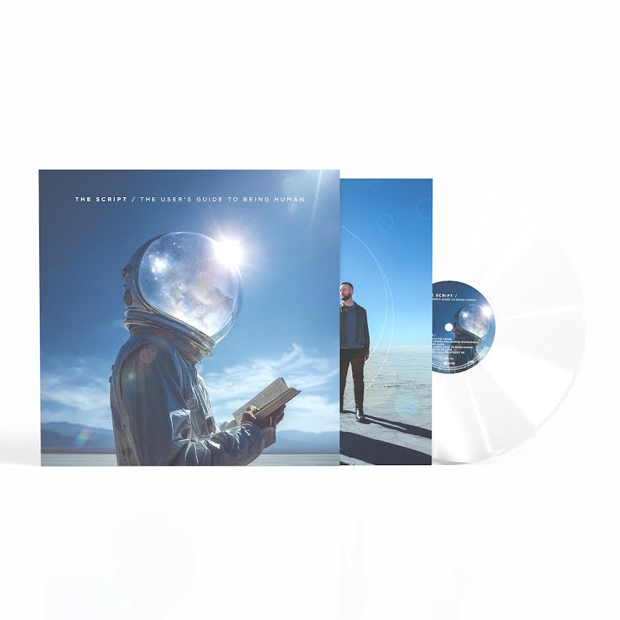 The Script - The User's Guide to Being Human (Transparent Clear) Vinyl Music album packaging with an astronaut and person on a white background