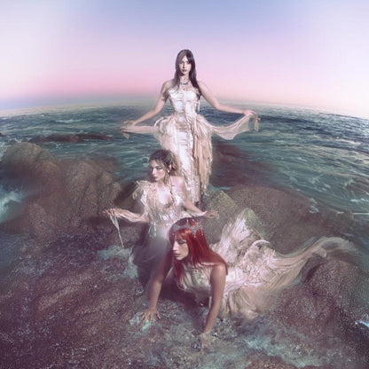 The Warning - Everything's Falling (Feather) Vinyl Three women in elegant dresses standing on rocks with a gradient sky.