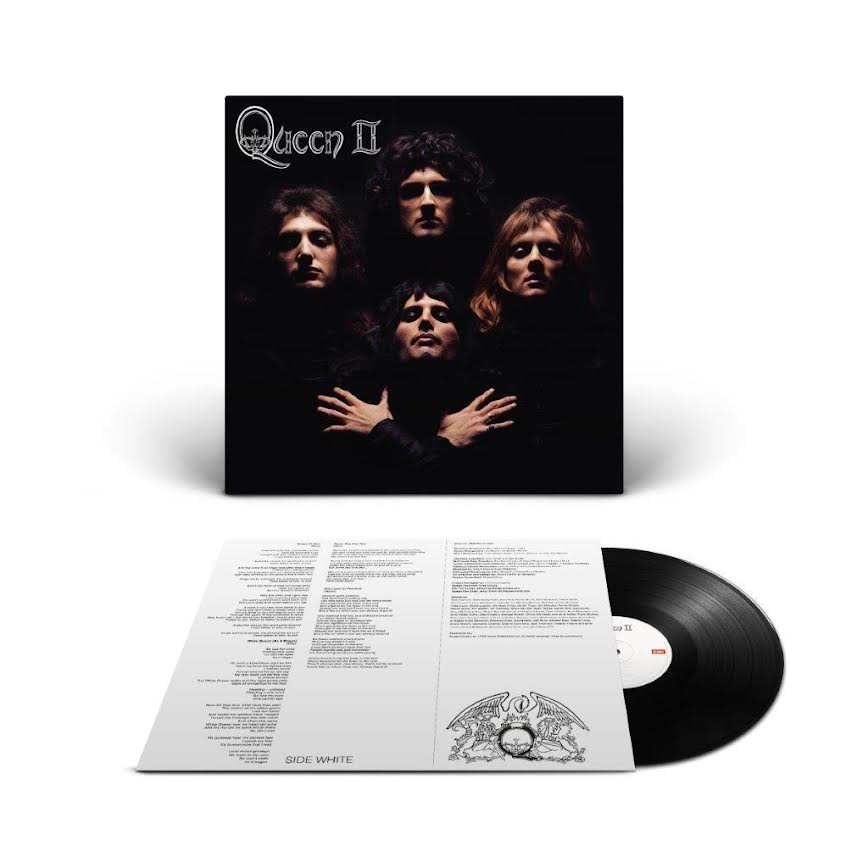 Queen Vinyl record with cover featuring a band's faces and text on a white background
