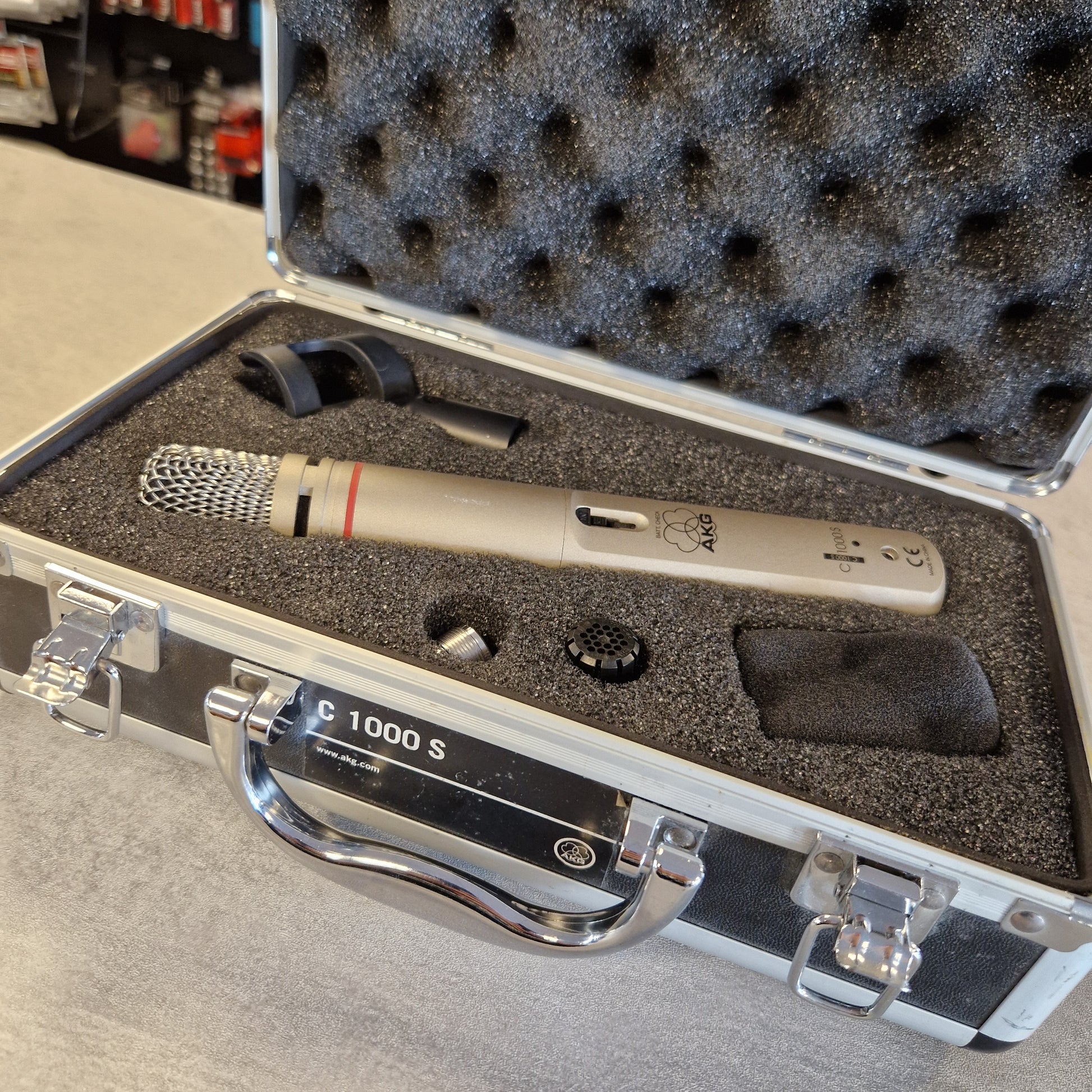 AKG C1000S Microphone in a protective case with foam lining