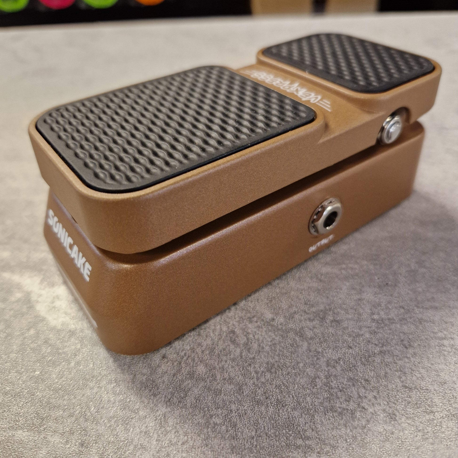 Pre-Owned Sonicake Brown guitar effects pedal with 'Soniccake' branding on a textured surface