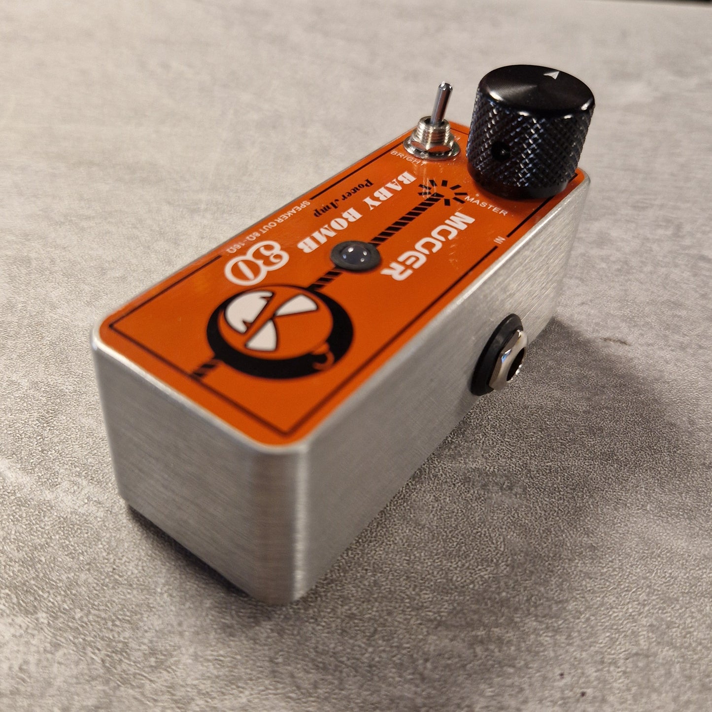 Pre-Owned Mooer Moog Little Big Monster guitar effects pedal on a textured surface
