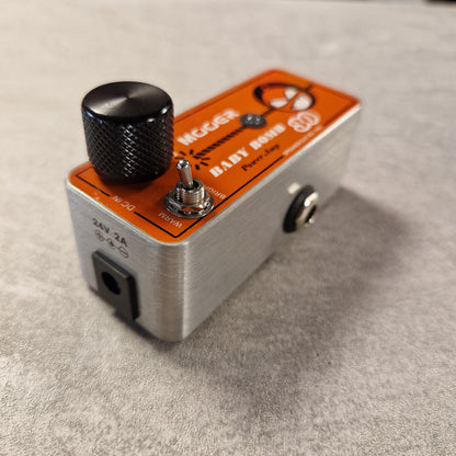 Pre-Owned Mooer Guitar effects pedal with orange and silver design on a grey surface