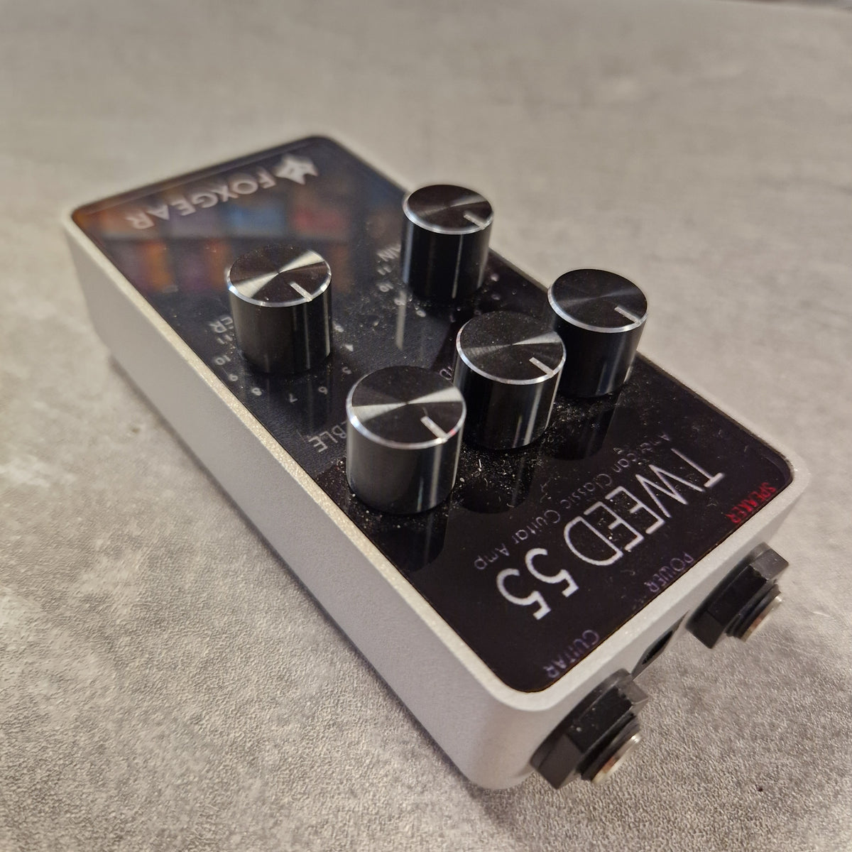 Pre-Owned FoxGear Tweed 55 guitar effects pedal on a textured surface