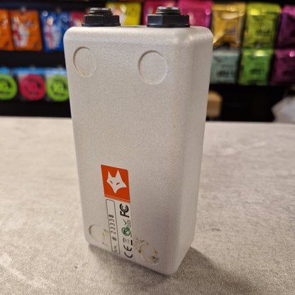 Pre-Owned FoxGear Grey electronic device with a logo on a textured surface