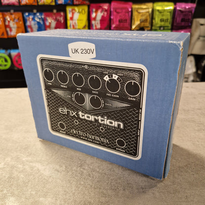Pre-Owned Electro-Harmonix Blue box with electronic device illustration and 'ehxtortion' branding on a textured surface.