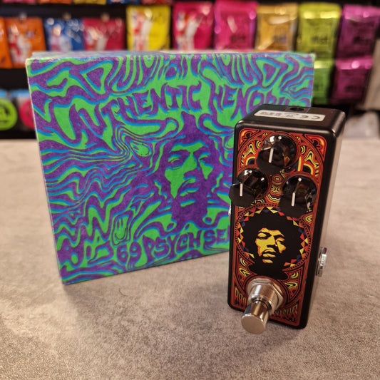 Pre-Owned Dunlop Music effect pedal with colourful packaging on a textured surface