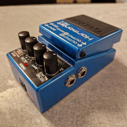 Pre-Owned Boss Blue guitar effects pedal with visible branding on a grey surface