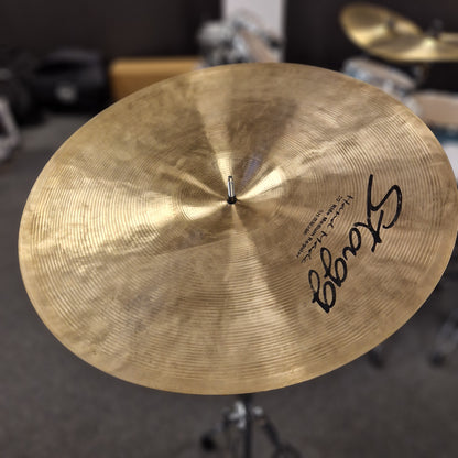 Pre-Owned Stagg Close-up of a Stagg cymbal with a blurred drum set background