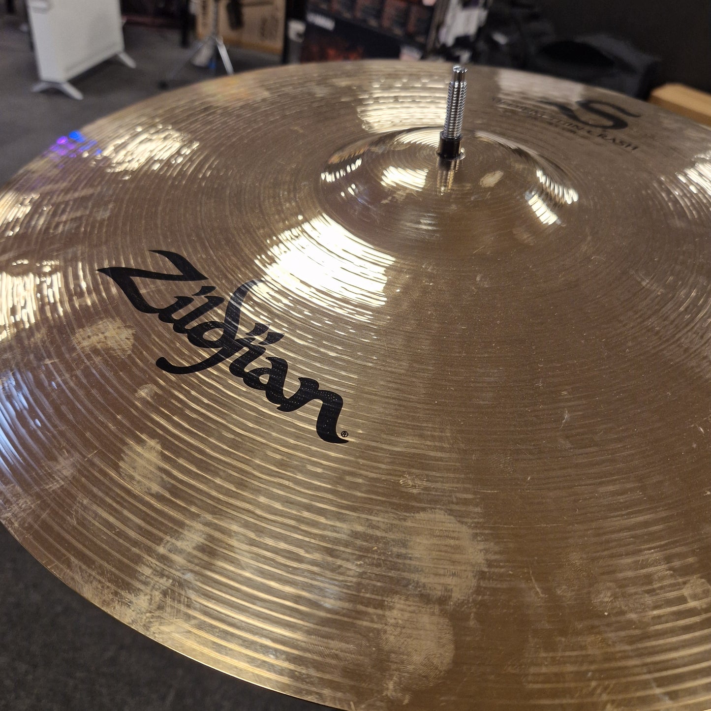 Pre-Owned Zildjian cymbal with a blurred background