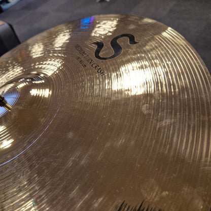 Pre-Owned Zildjian Close-up of a cymbal with 'S' logo and 'Crash' text on a blurred background