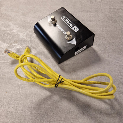 Pre-Owned Line 6 Guitar effects pedal with a yellow cable on a grey surface
