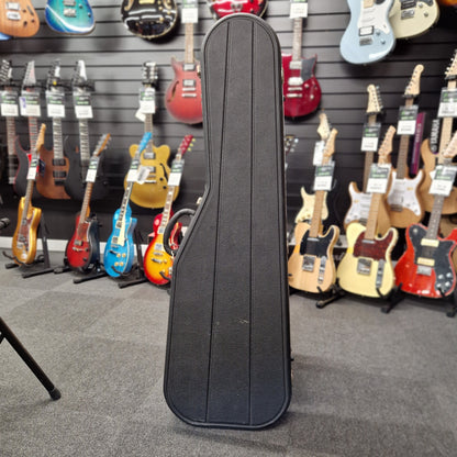 Pre-Owned Hiscox hard case on a blurry shop background