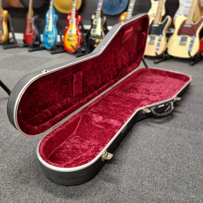 Pre-Owned Hiscox hard case on a blurry shop background