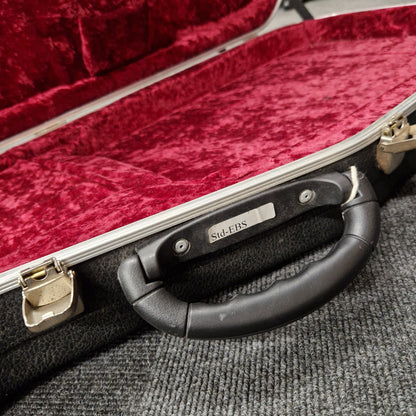 Pre-Owned Hiscox hard case on a blurry shop background