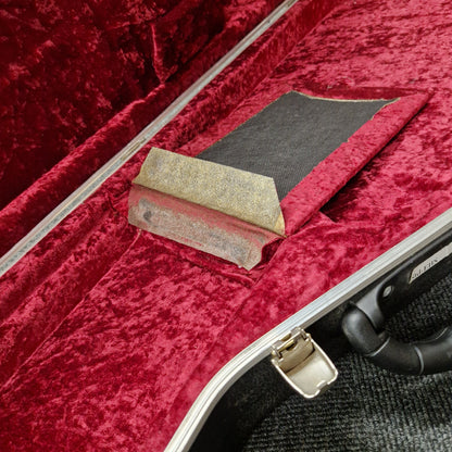 Pre-Owned Hiscox hard case on a blurry shop background