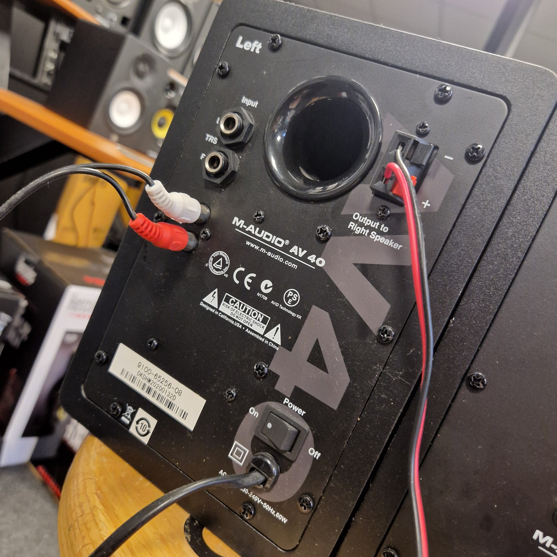 Pre-Owned M-Audio AV40 Studio Monitors Back view of an audio speaker with wiring and brand name visible