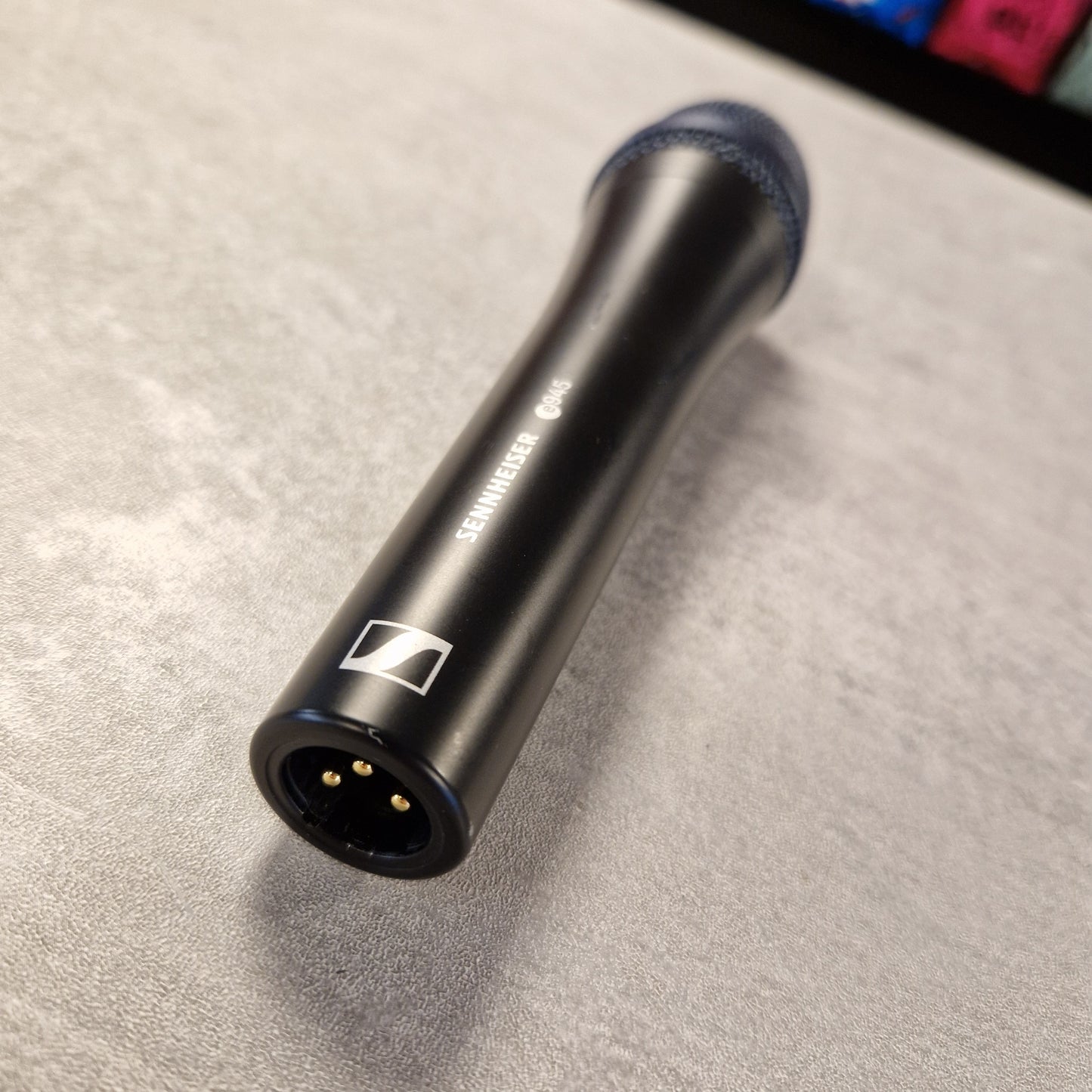 Pre-Owned Sennheiser E935 Sennheiser microphone on a textured surface