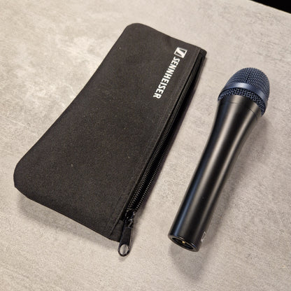 Pre-Owned Sennheiser E935 Sennheiser microphone and carrying case on a beige surface