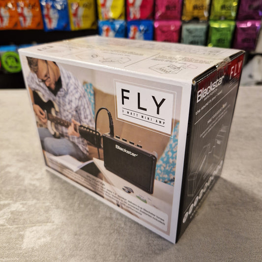 Pre-Owned Blackstar  Product packaging with 'FLY' branding on a gray surface